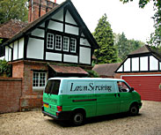 Lawn Servicing van outside house